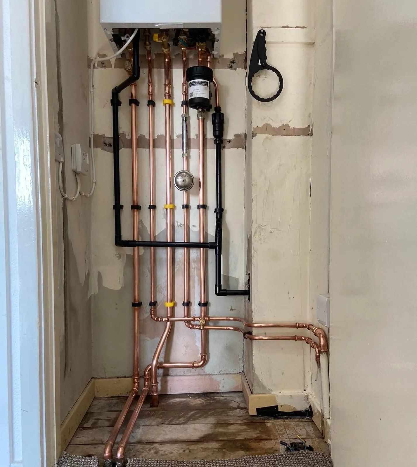 First fix copper pipework for a shower, run and tested before the wall is boarded